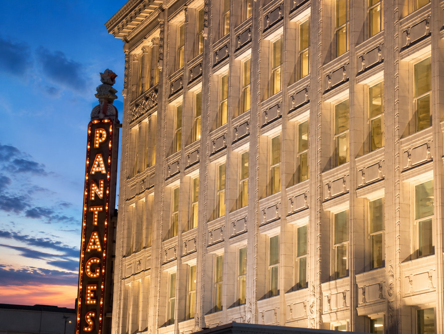 Pantages Theatre illuminated marquee at dusk — Tacoma Theater District, steps from the Kress Building