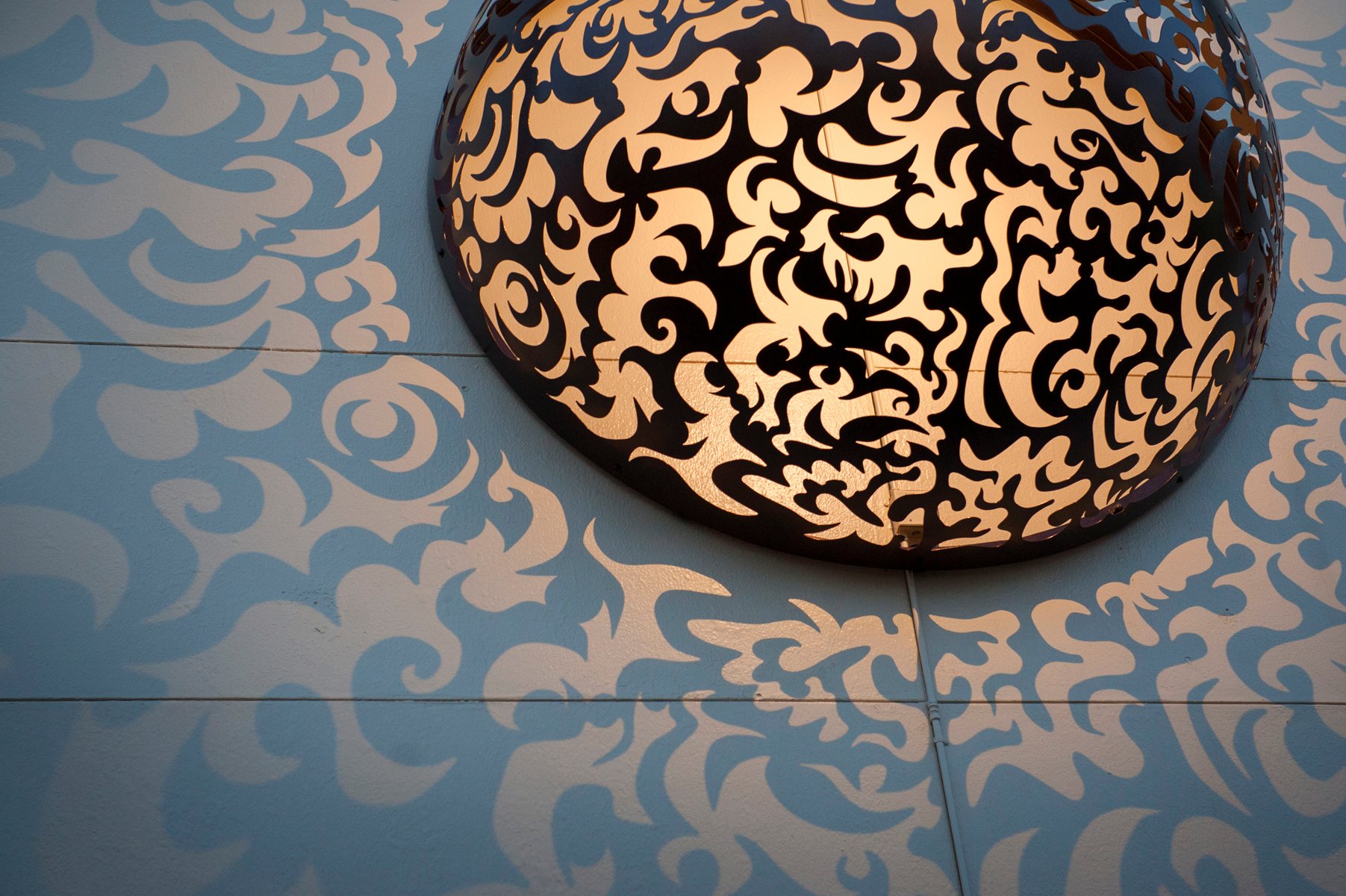Close-up of a laser-cut steel sphere by Seattle artist Jonathan Clarren — commissioned facade installation on the Kress Building, 932 Broadway, Tacoma